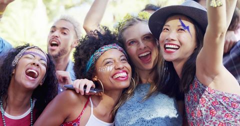 Joyful Friends Taking Selfie Celebrating at Festival