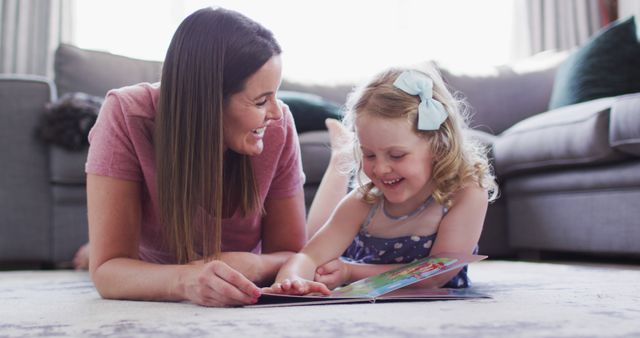 Mother Reading Book with Daughter at Home in Living Room - Download Free Stock Images Pikwizard.com