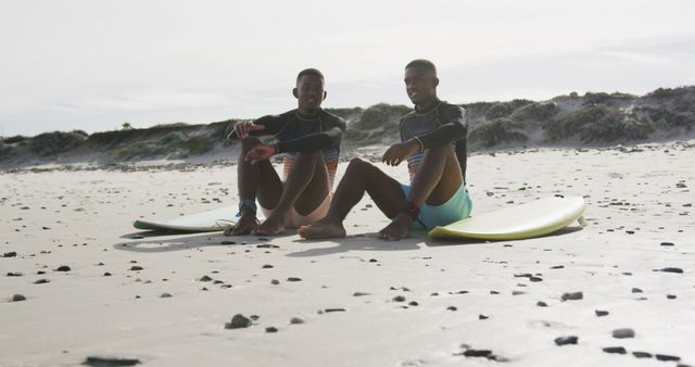 Friends Relaxing with Surfboards on Sandy Beach - Download Free Stock Images Pikwizard.com