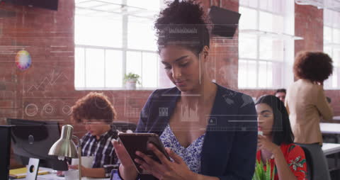 Biracial Woman Engaging with Technology in Classroom setting