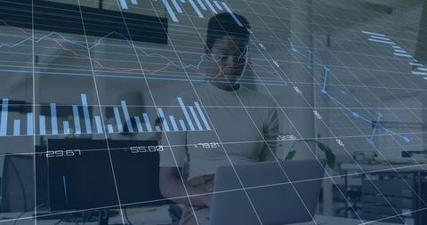 Businesswoman Analyzing Financial Data with Futuristic Graphics - Download Free Stock Images Pikwizard.com