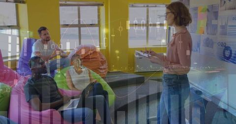 Creative Team Collaboration in Modern Office Lounge with Charts Overlay