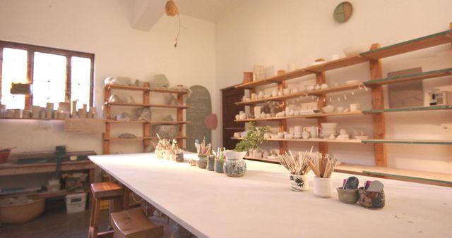 Pottery Studio Craft Room with Shelves and Work Table - Download Free Stock Images Pikwizard.com