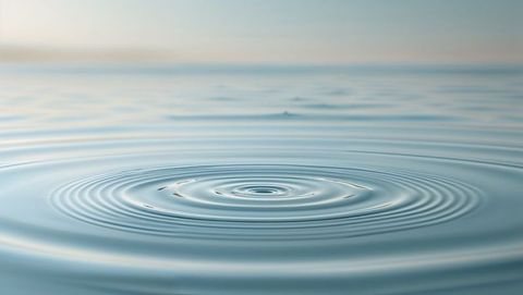 Tranquil water ripples on serene lake