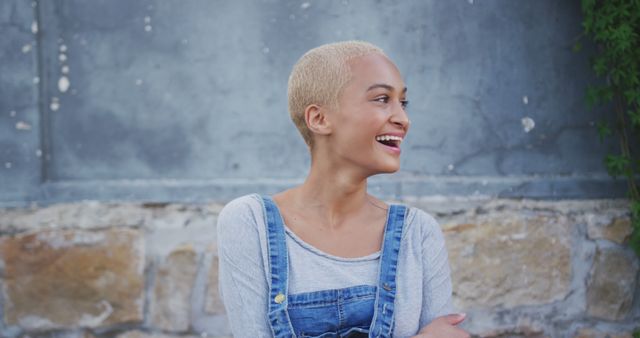 Smiling Young Woman with Blonde Buzzcut Wearing Overalls - Download Free Stock Images Pikwizard.com
