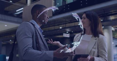 Professionals Discussing Holographic Globe in Modern Workspace