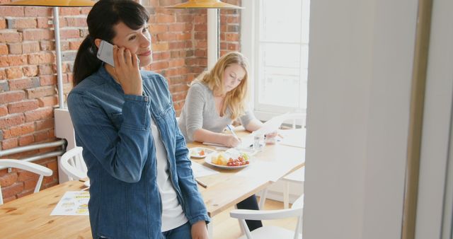 Two Women Collaborating in Informal Office Setting - Download Free Stock Images Pikwizard.com