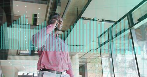 Businessman in Red Shirt Analyzing Data with Digital Chart Overlay