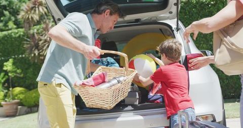 Family Packing Car for Fun Summer Holiday Getaway