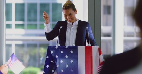 Female politician inspiring at outdoor rally