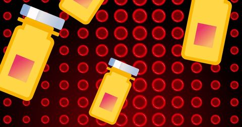 Yellow Pills with Red Blood Cells on Black Background