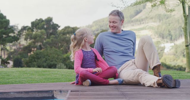 Father and Daughter Bonding Outdoors on Wooden Deck - Download Free Stock Images Pikwizard.com