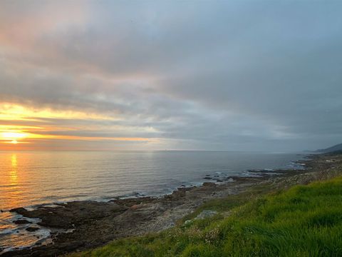 Scenic Coastline Landscape with Gentle Sunset on Horizon