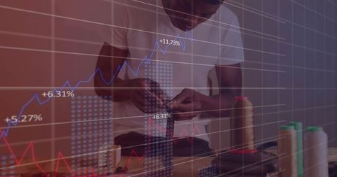 Tailor working with financial charts overlay representing innovation