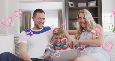 Happy Family Using Tablet with Floating Hearts