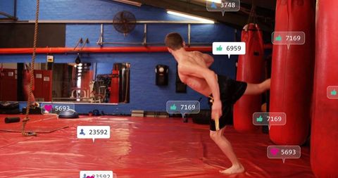 Teen practicing powerful side kick in martial arts gym