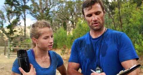 Exhausted Athletes Discuss Training Progress Outdoors - Download Free Stock Images Pikwizard.com