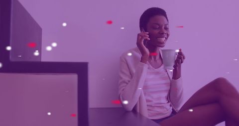 Happy woman on smartphone in cozy space with digital effects