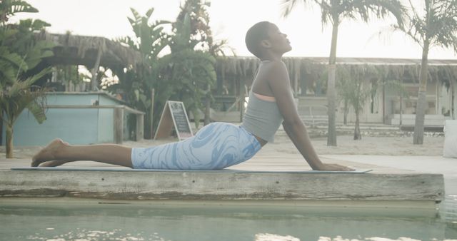 Peaceful Yoga Session Outdoors by Tropical Poolside - Download Free Stock Images Pikwizard.com