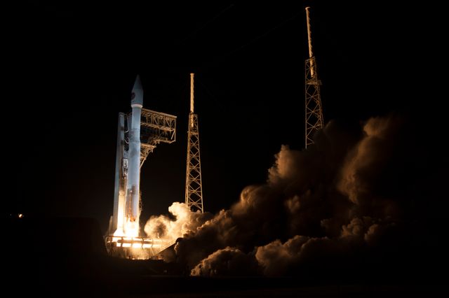 This awe-inspiring photo captures the Atlas V rocket lifting off from Space Launch Complex 41 at Cape Canaveral, carrying the Cygnus resupply spacecraft to the International Space Station. This moment took place late at night, adding dramatic lighting and highlighting the powerful rocket flames and smoke during launch. This image can be employed in articles, presentations, and educational content related to space exploration, commercial resupply missions, and NASA's endeavors. It also suits use in promotional materials for aerospace technology and innovation.