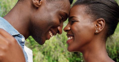 Loving African American Couple Sharing Tender Gazes in Paradise