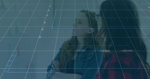 Colleagues Analyzing Plans with Digital Overlay