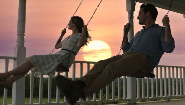 Couple Swinging on Porch at Pastel Sunset Romantic Veranda Moment Golden Hour