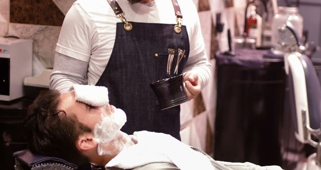 Barber in Apron and Beard Grooming Client with Foam and Towel - Download Free Stock Images Pikwizard.com