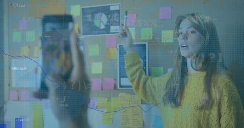 Young Businesswoman Presenting Financial Data Analysis in Modern Office