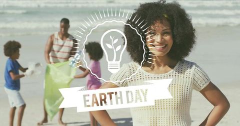 Young Black woman leading beach cleanup, volunteers collecting ocean debris for Earth Day