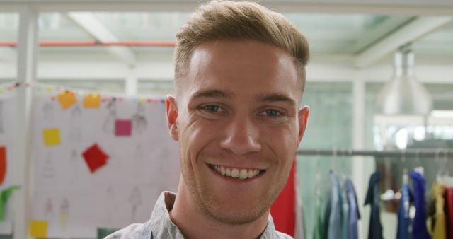 Smiling Young Man in Modern Office Setting - Download Free Stock Images Pikwizard.com