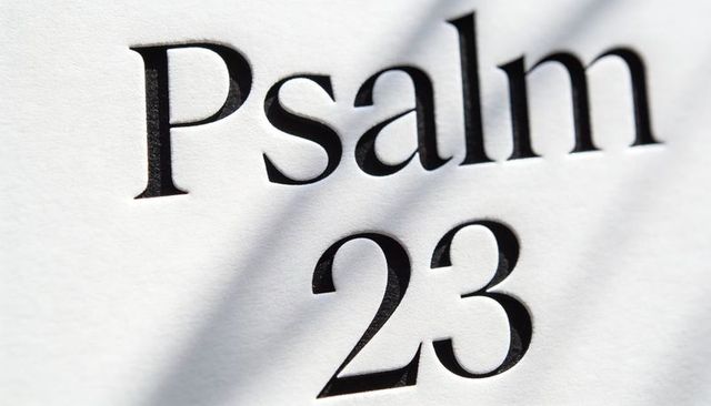 Psalm 23 embossing on textured paper with deep serif typography and soft shadow clean mono layout