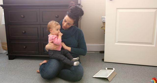 Mother Holding Baby on Floor of Nursery Room - Download Free Stock Images Pikwizard.com