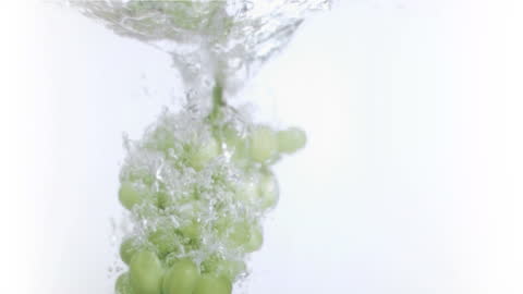 Fresh Green Grapes Drop in Splashing Water