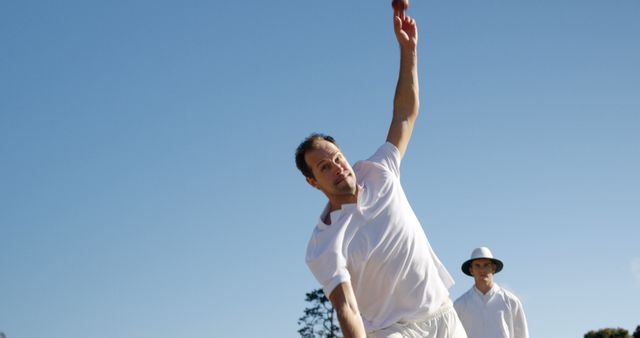 Cricketer Bowling Under Clear Blue Sky During Match - Download Free Stock Images Pikwizard.com