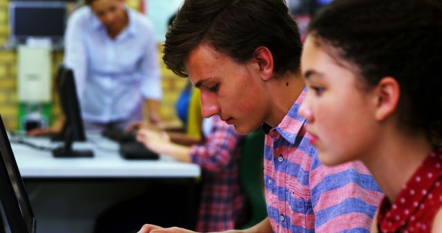 Focused Students Typing on Computers in Classroom - Download Free Stock Images Pikwizard.com