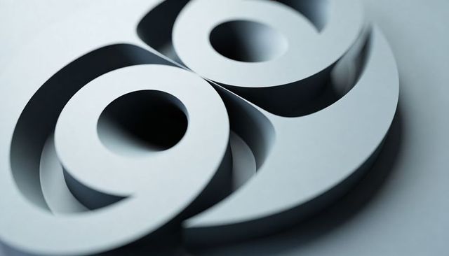 Minimalist layered cut-paper loops showing geometric paper sculpture with matte finish