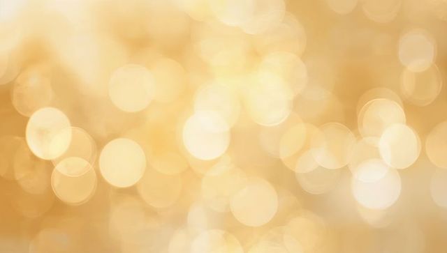 Glowing Golden Bokeh Background with Soft Amber Circles Creating Warm Festive Glow