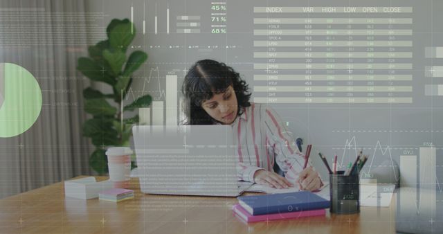 Woman Analyzing Financial Data on Laptop at Office Desk - Download Free Stock Images Pikwizard.com