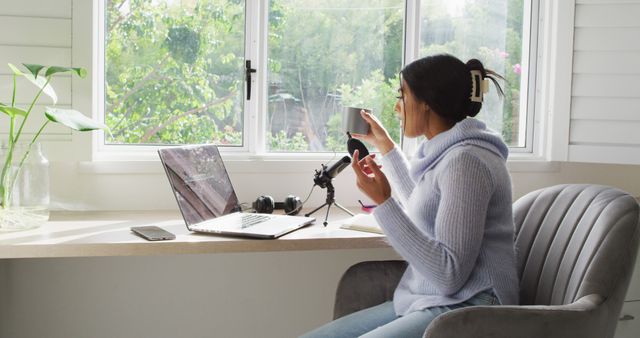 Woman Working from Home with Laptop and Phone by Window - Download Free Stock Images Pikwizard.com