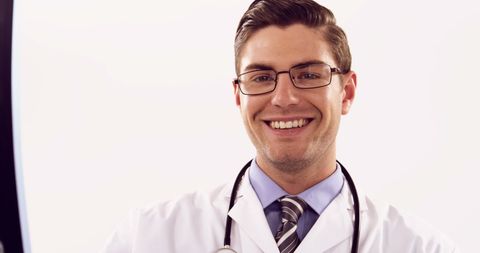 Confident Doctor Analyzing X-Ray in Modern Office - Download Free Stock Images Pikwizard.com