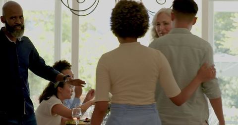 Elegant gathering at outdoor wedding with attentive waitstaff