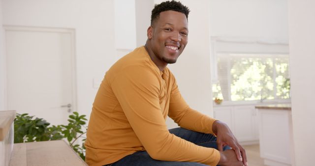 Happy Man Sitting on Stairs at Home in Casual Wear - Download Free Stock Images Pikwizard.com