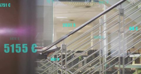 Modern office staircase showing tablet, steel handrail and cyan financial data overlays