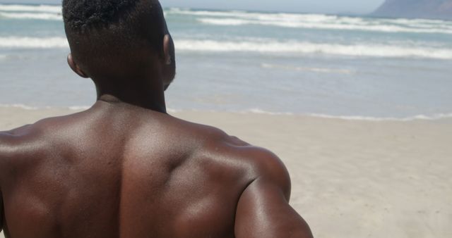 Muscular Man at Beach Looking at Ocean Waves - Download Free Stock Images Pikwizard.com