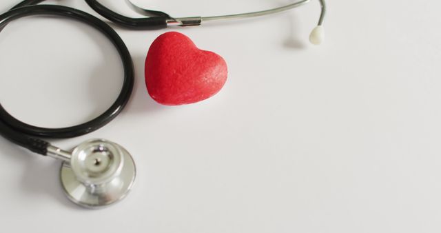 Image of close up of stethoscope with heart on pink background - Download Free Stock Photos Pikwizard.com