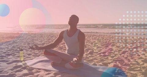 Serene African American Man Meditating on Beach at Sunset