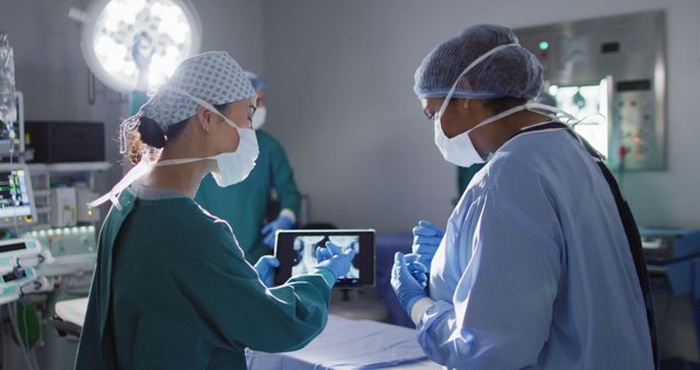 Healthcare Professionals Collaborating in Operating Room - Download Free Stock Images Pikwizard.com