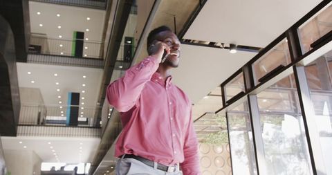 Confident Professional Walking in Modern Office Talking on Phone