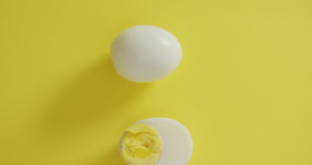Boiled Egg Halves on Bright Yellow Background - Download Free Stock Images Pikwizard.com